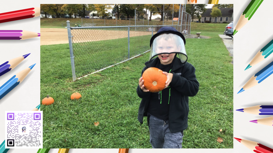  A boy holding a Pumpkin
